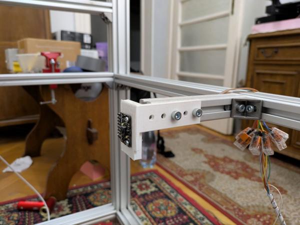 Close-up of the PAA5100JE optical sensor mounted in its 3D-printed housing.