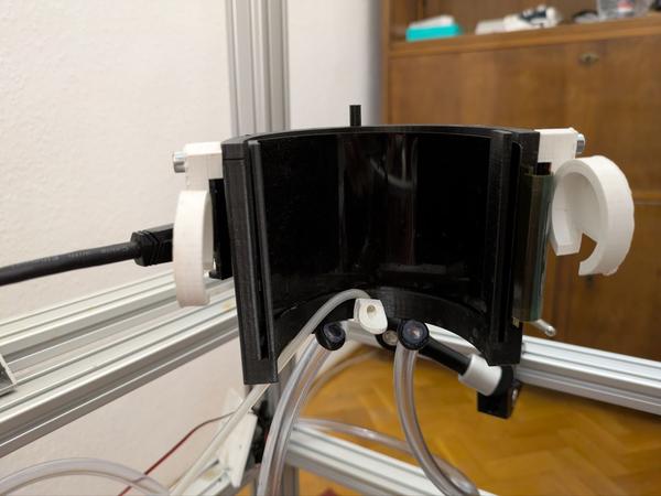 The curved OLED display mounted in its 3D-printed holder.